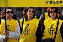 Medlemmer af Amnesty International ved en demonstration i Madrid til fordel det egyptiske folk. Februar 2011.