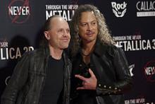Den danske trommeslager Lars Ulrich og den amerikanske guitarist  Kirk Lee Hammett fra heavy metal bandet Metallica ved premieren til filmen 'Metallica 3D Through the Never'i Madrid i 2013.